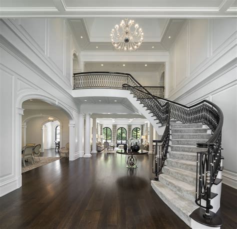 Floating Staircase In Double Height Foyer Of Georgian Style Home