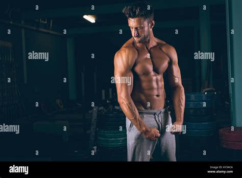 Muscular Man Flexing His Muscles Stock Photo Alamy