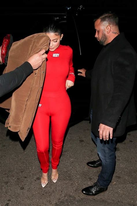 Kylie Jenner Shows Off Her Curves In A Red Jumpsuit As She Arrives At