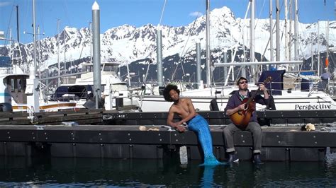 Alaskan Merman Sings Dock Of The Bay While Sitting On The Dock Of An