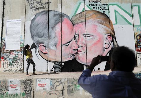 Watch West Bank Graffiti Depicts Netanyahu And Trump Locking Lips