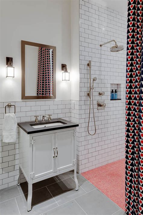 Exposed brick and graphic gray and white floor tiles surround a gray bathroom vanity to create a gorgeous blend of contemporary style. White brick tile bathroom | Custom homes, White brick ...
