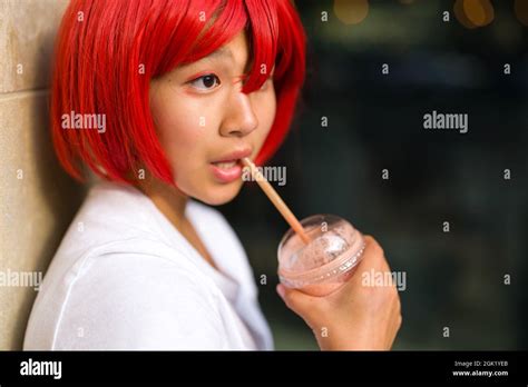 Closeup Of Teenage Asian Cosplay Actress Drinking A Smoothie Teenage Girl Drinking A Smoothie