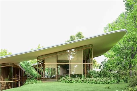 This Architectural Design Features A Majestic Green Roof That Follows