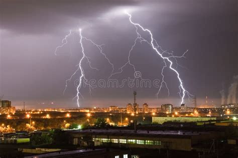 Powerful Flash Lightning Hitting The City At Night Over Dark Gray Sky