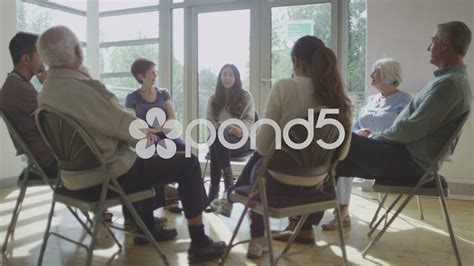 People in group therapy session talk about their problems in sunlit room Stock Footage,#session# ...