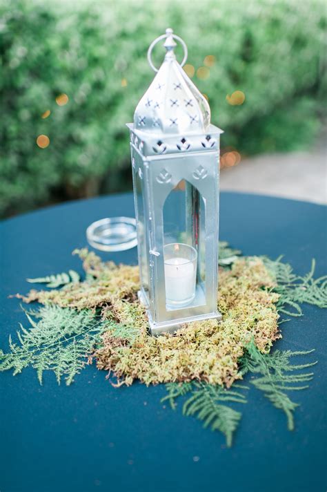 silver moroccan style lantern and candle centerpiece