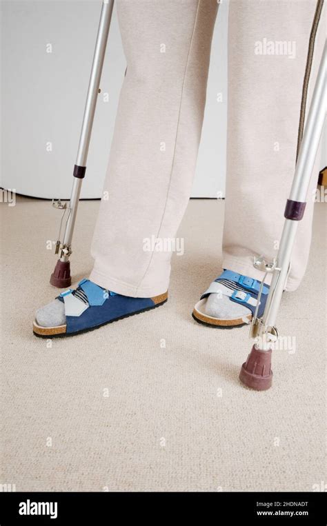 Female Using Crutches Hi Res Stock Photography And Images Alamy