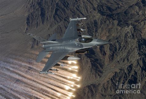An F 16 Fighting Falcon Releases Flares Photograph By High G Productions