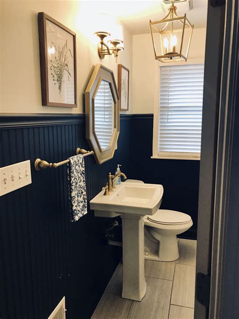 I've shared my bathroom makeover full of fun diy's paint is cheap and makes a huge difference! Navy Beadboard with gold spray painted fixtures ...