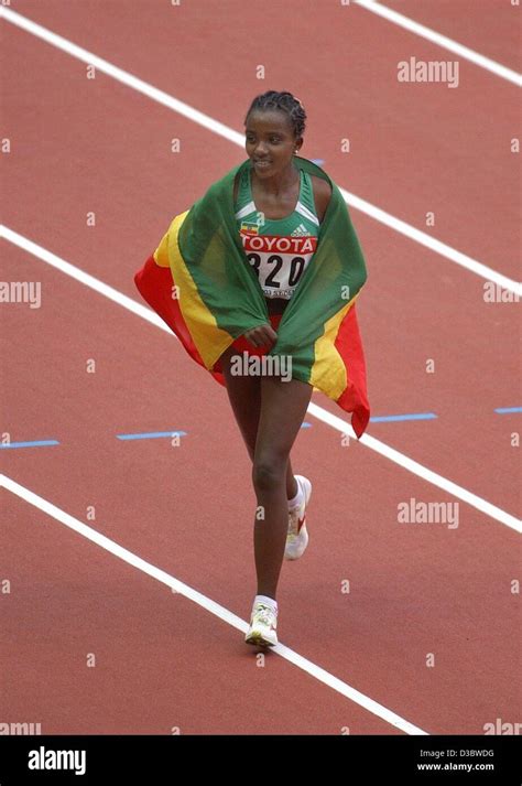 Dpa Ethiopian Long Distance Runner Tirunesh Dibaba Jubilates With Her National Flag After