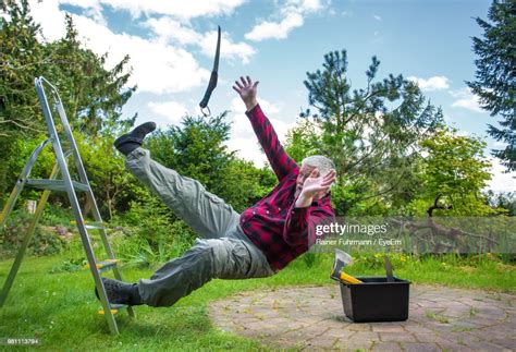 Senior Man Falling From Ladder In Garden High Res Stock Photo Getty