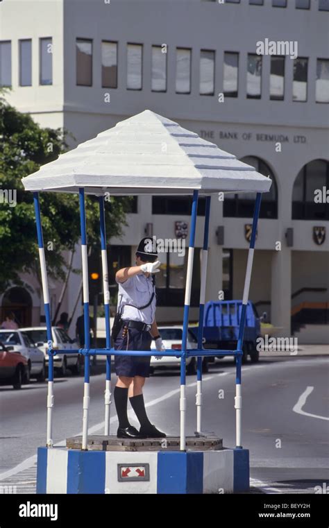 policeman directing traffic in the birdcage on front street in hamilton on the island of bermuda
