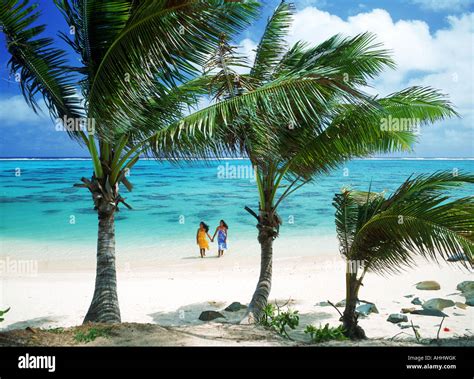 Two Polynesian Women In Sarongs On Rarotonga Beach In Cook Islands