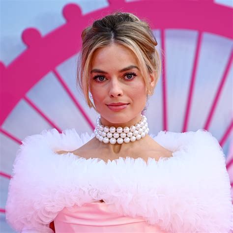 margot robbie is doing barbie promo in iconic vintage versace and i m obsessed glamour