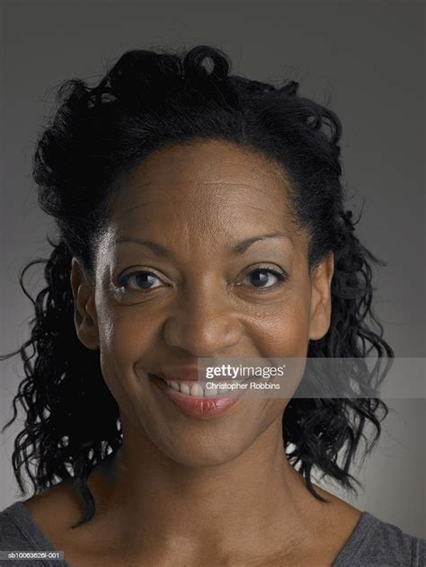 Mature Woman Smiling Portrait Closeup High Res Stock Photo Getty Images