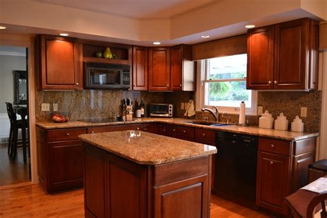 The rich, calming hue of natural cherry wood offers a homey feel to the kitchen. Cherry Cabinets with Granite Countertops - Home Furniture ...