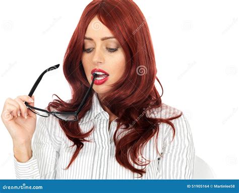 Young Business Woman Holding Glasses In Her Mouth Looking Concerned And
