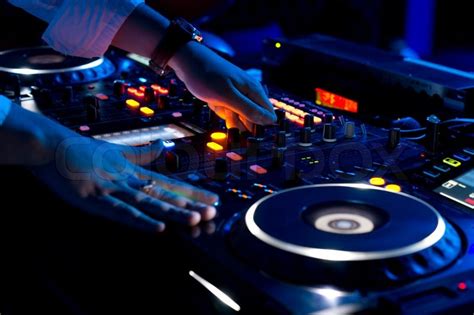 Here is a comprehensive list of where to look for new music to this post is full of tips on where to look and get inspiration for music, new, old, remixed and most pools now offer intro edits of radio songs to help dj's mix and blend them easier which is very helpful. Hands of a DJ mixing music at a disco | Stock Photo | Colourbox