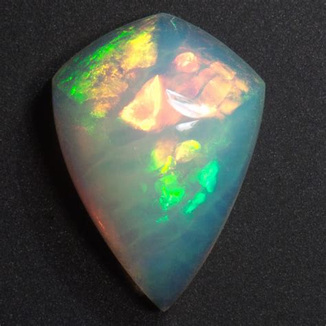 Iridescent Opal Dazzles With Neon Fireworks Naturally Hidden Within
