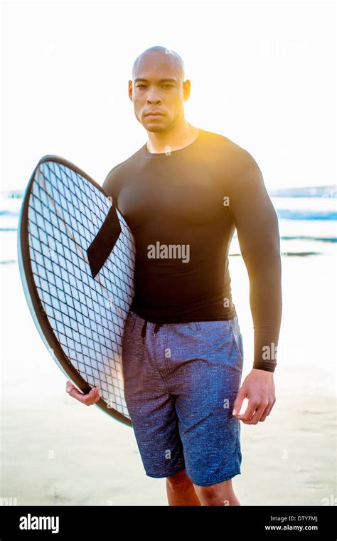 Man Holding Surfboard Hi Res Stock Photography And Images Alamy