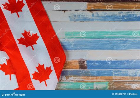Canadian Red And White Flag Against Dark Rustic Background For Canada