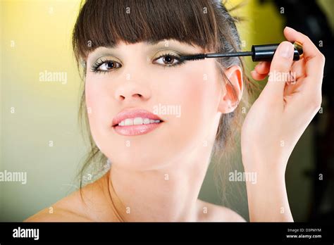 Pretty Woman Applying Mascara Stock Photo Alamy