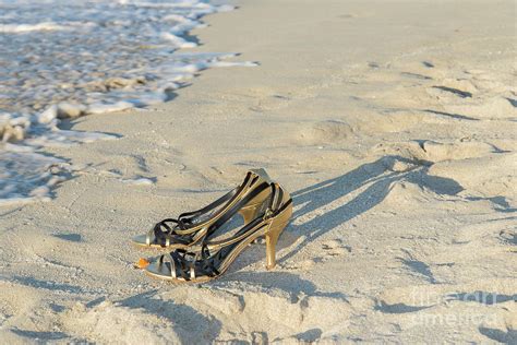 Golden High Heel Shoes On The Beach Photograph By Les Palenik