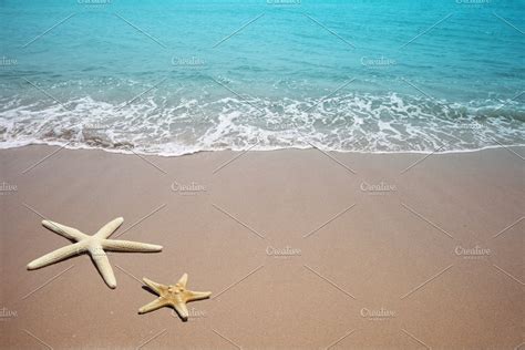 Two Starfish On A Beach Sand Sea Featuring Sea Starfish And Beach