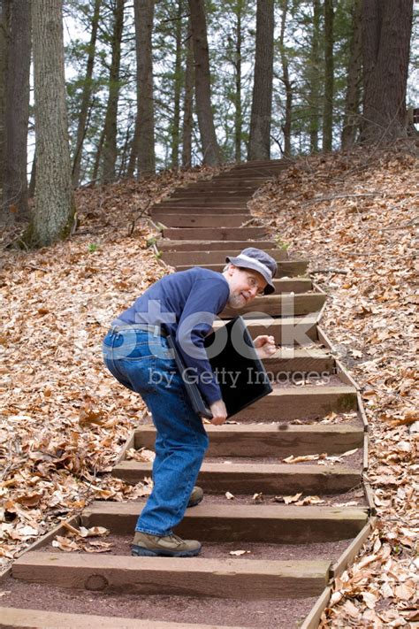 Old Geek With Laptop Climbing Steps Stock Photo Royalty Free Freeimages