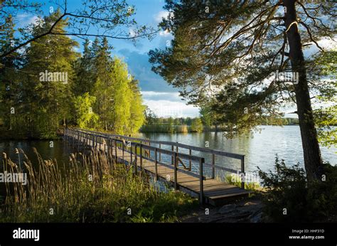 Wood Bridge Over Lake In Sweden At Sunset Stock Photo Alamy