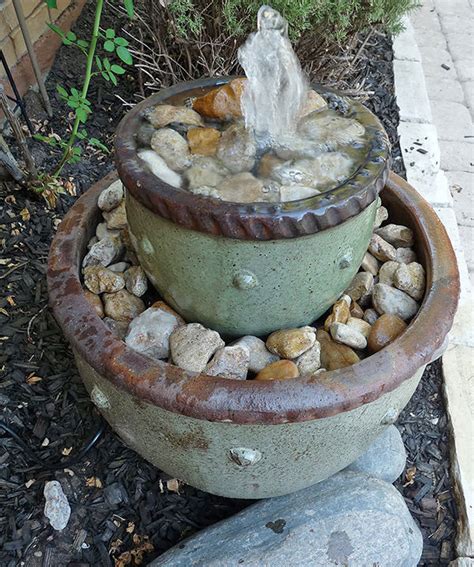 The interesting fact about this planter is that the planter's sides are made from reclaimed wood in a very playful chevron pattern. 7 Soothing DIY Garden Fountains | The Garden Glove
