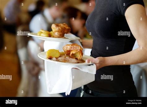 Waitress Is Carrying Two Plates With Meat Dish Stock Photo Alamy