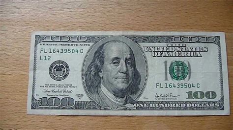 I don't have a hundred dollar bill on me to check, but i read on another site that the clock face isn't even visible without the aid of a magnifying glass. 100 Dollar bill / 100 Dollar banknote Series 2003A - YouTube