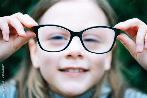 Closeup Portrait Of Little Girl With Myopia Correction Glasses Girl Is