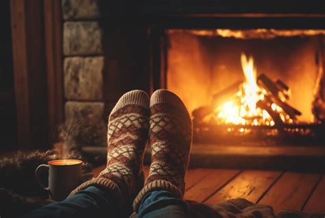 Premium Ai Image Young Romantic Couple Sitting On Sofa In Front Of Fireplace Warming And