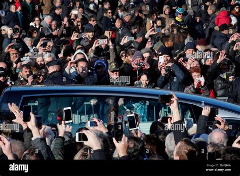 Fans watch Johnny Hallyday's hearse during his funeral ceremony in