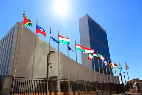 United Nations Headquarters With Waving Flags In New York Usa Stock