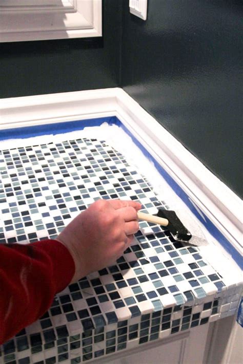 Get inspired by a varied collection of pictures and ideas for tiles installed on kitchen and bathroom countertops. How to Paint Tile Countertops and our Modern Bathroom ...