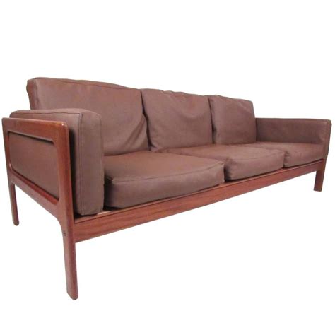We believe in master craftsman ship and have been in business since 1971. Danish Modern Teak Sofa by Komfort For Sale at 1stdibs