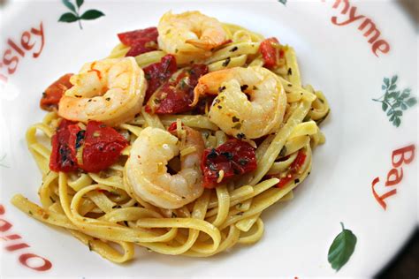 Shrimp With Roasted Red Peppers And Pasta Cooking On The Front Burner