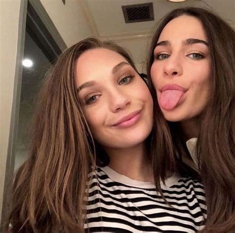 Two Women Are Taking A Selfie With Their Tongue Out And One Is Sticking Her Tongue Out