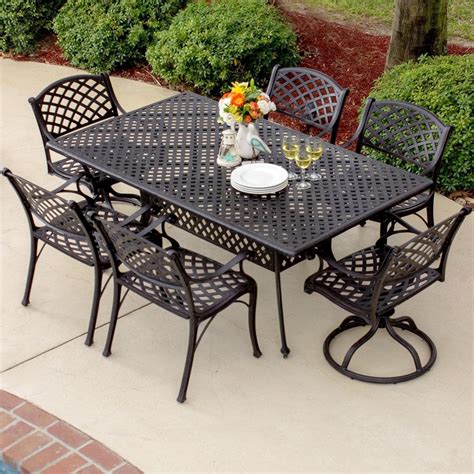 Heavy duty cast aluminum outdoor dinning table with six chairs, umbrella and umbrella stand. Heritage 7 Piece Cast Aluminum Patio Dining Set With 2 ...