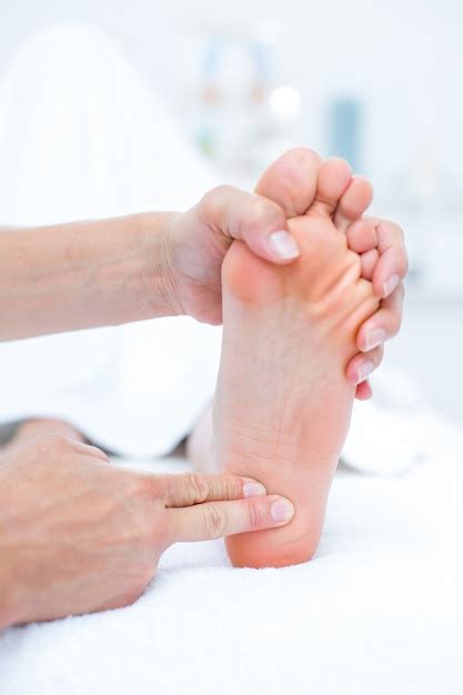 Premium Photo Physiotherapist Doing Foot Massage