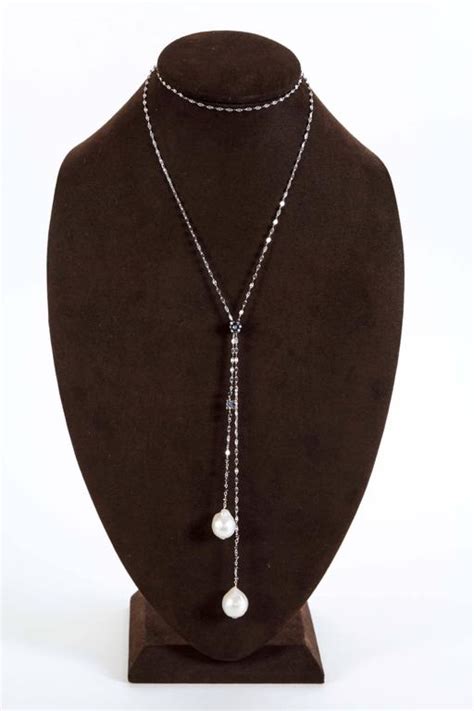 The second interpretation of a lariat is more common in high jewellery; Baroque Pearl Black Diamond Gold Lariat Necklace For Sale ...