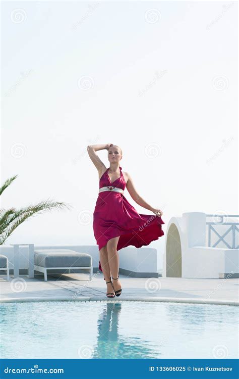 Attractive Girl In Red Dress Posing Near The Pool Stock Image Image