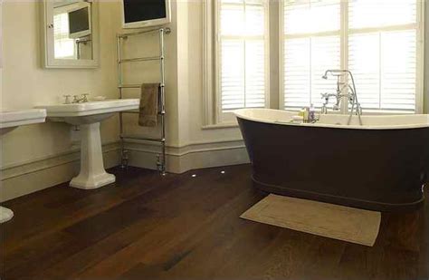 Parquet and tongue and groove floors are particularly ill suited for a damp bathroom; 20 Beautiful Bathrooms With Wood Laminate Flooring
