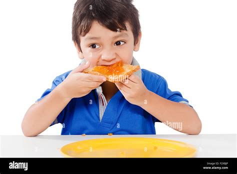 1 Indian Kid Boy Breakfast Eating Bread Stock Photo Alamy
