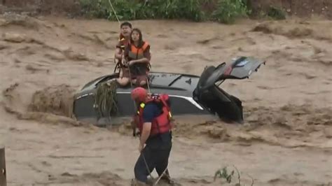 China Dramatic Rescue As Couple Gets Trapped In Raging Floods World News Sky News
