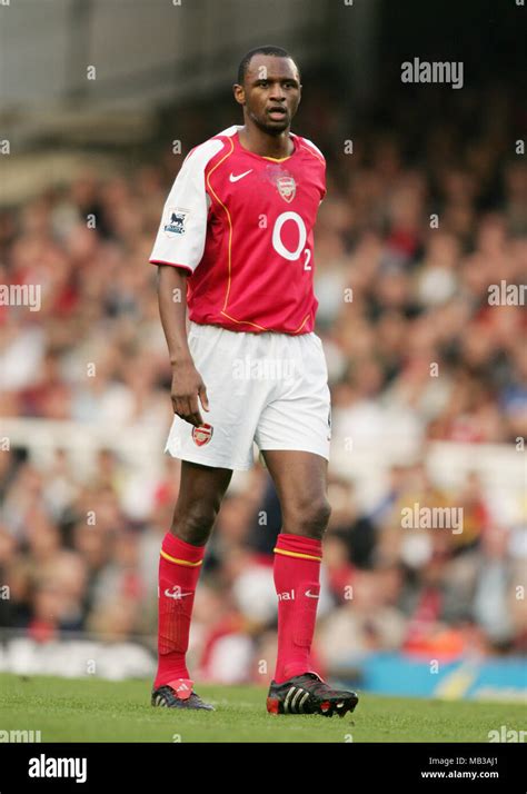 Patrick Vieira Playing For Arsenal At Highbury Stadium In The 2004 Season In O2 Sponsored Kit
